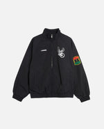 Nike Jordan x FTY men's black track jacket with graphic chest prints and sleeve patch.