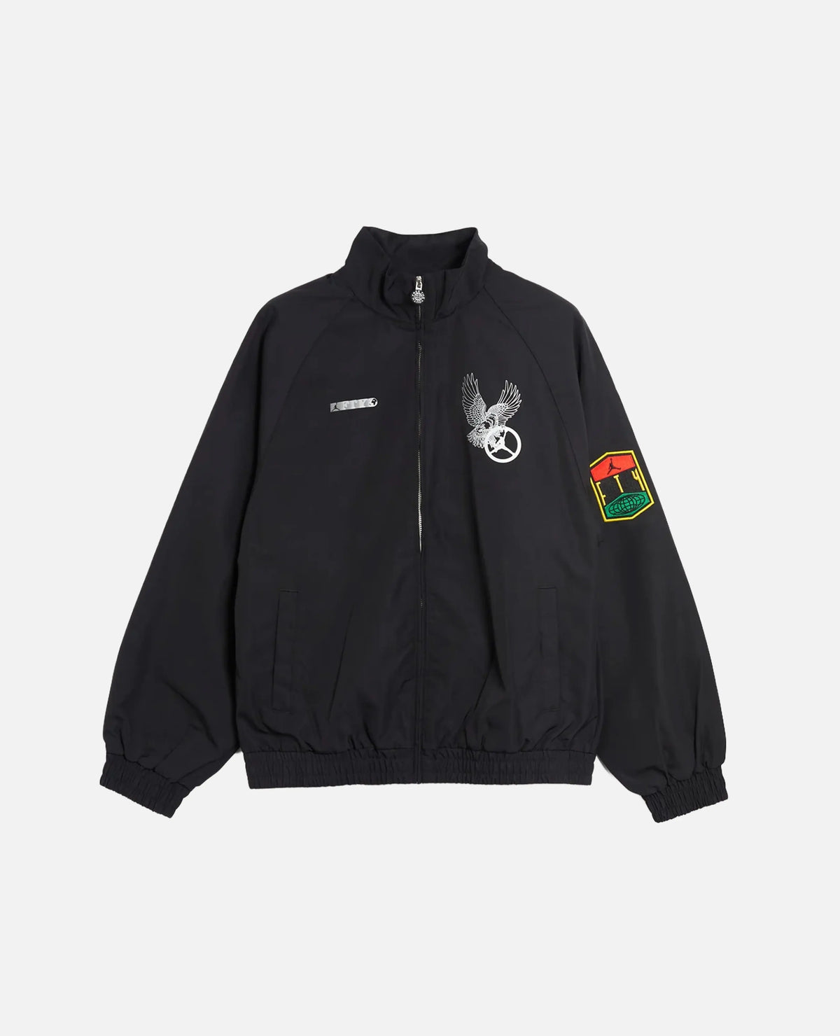 Nike Jordan x FTY men's black track jacket with graphic chest prints and sleeve patch.