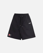 Front view of Nike Jordan x FTY black shorts with an elastic drawstring waist and logo patches.