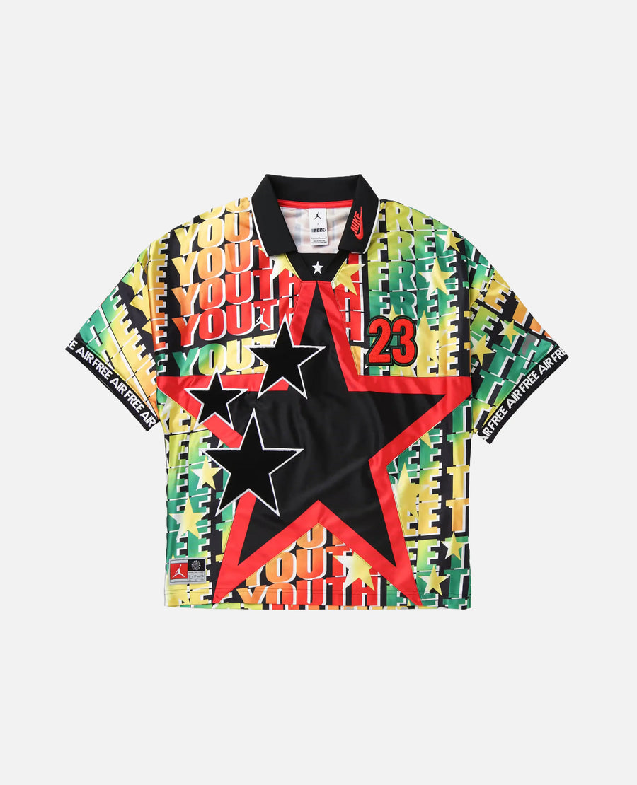 Front view of the Nike Jordan x FTY men's football jersey with vibrant multicolor graphics and star patches.