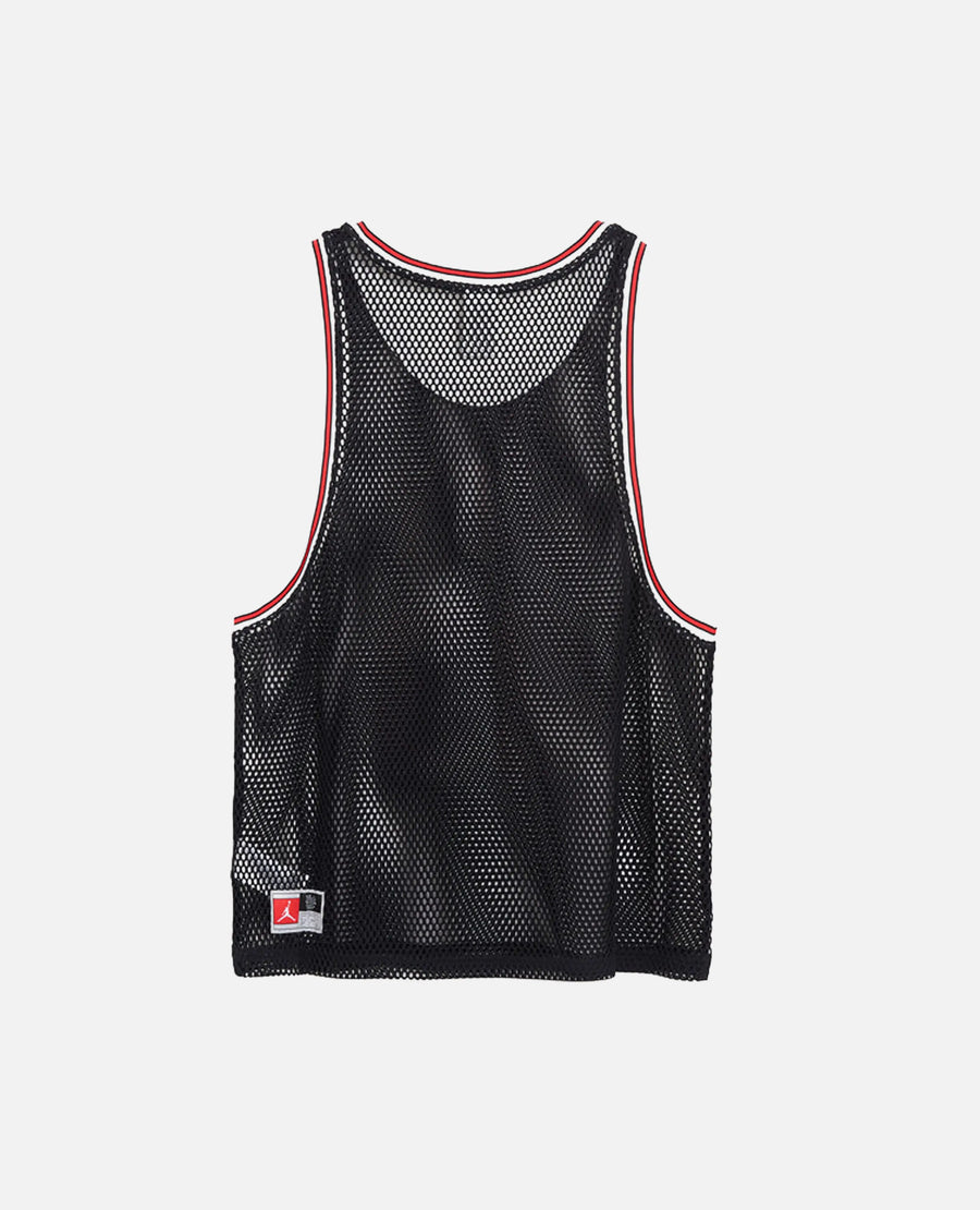 Back view of the Nike Jordan x FTY black mesh basketball jersey with red and white trim.