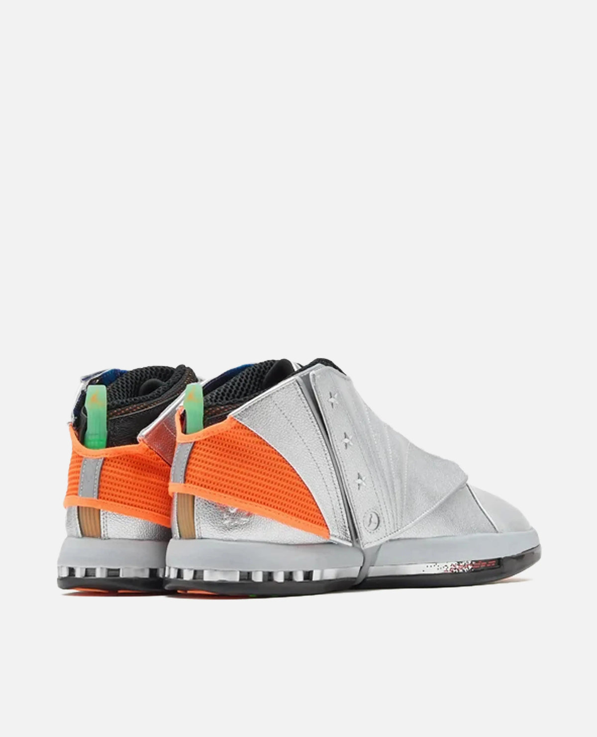 Rear three-quarter view of Air Jordan 16 x Free The Youth SP sneakers in metallic silver with bright orange mesh.