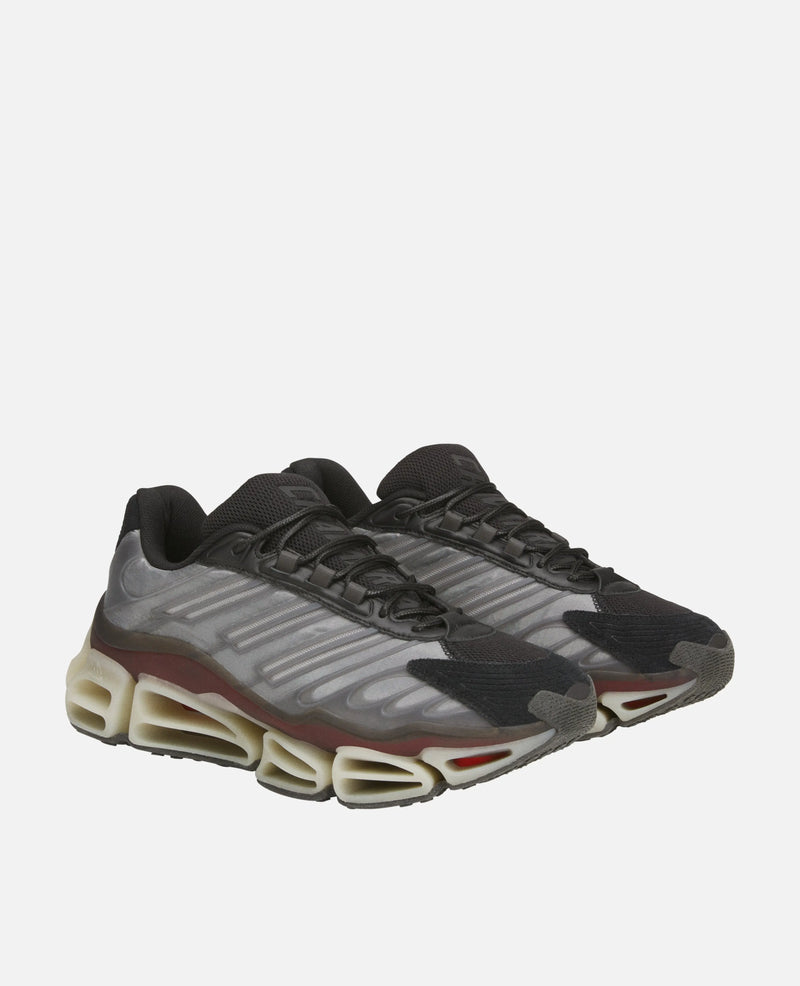Adidas Chavarria Megaride sneakers in black and grey, displayed in a three-quarter studio view.