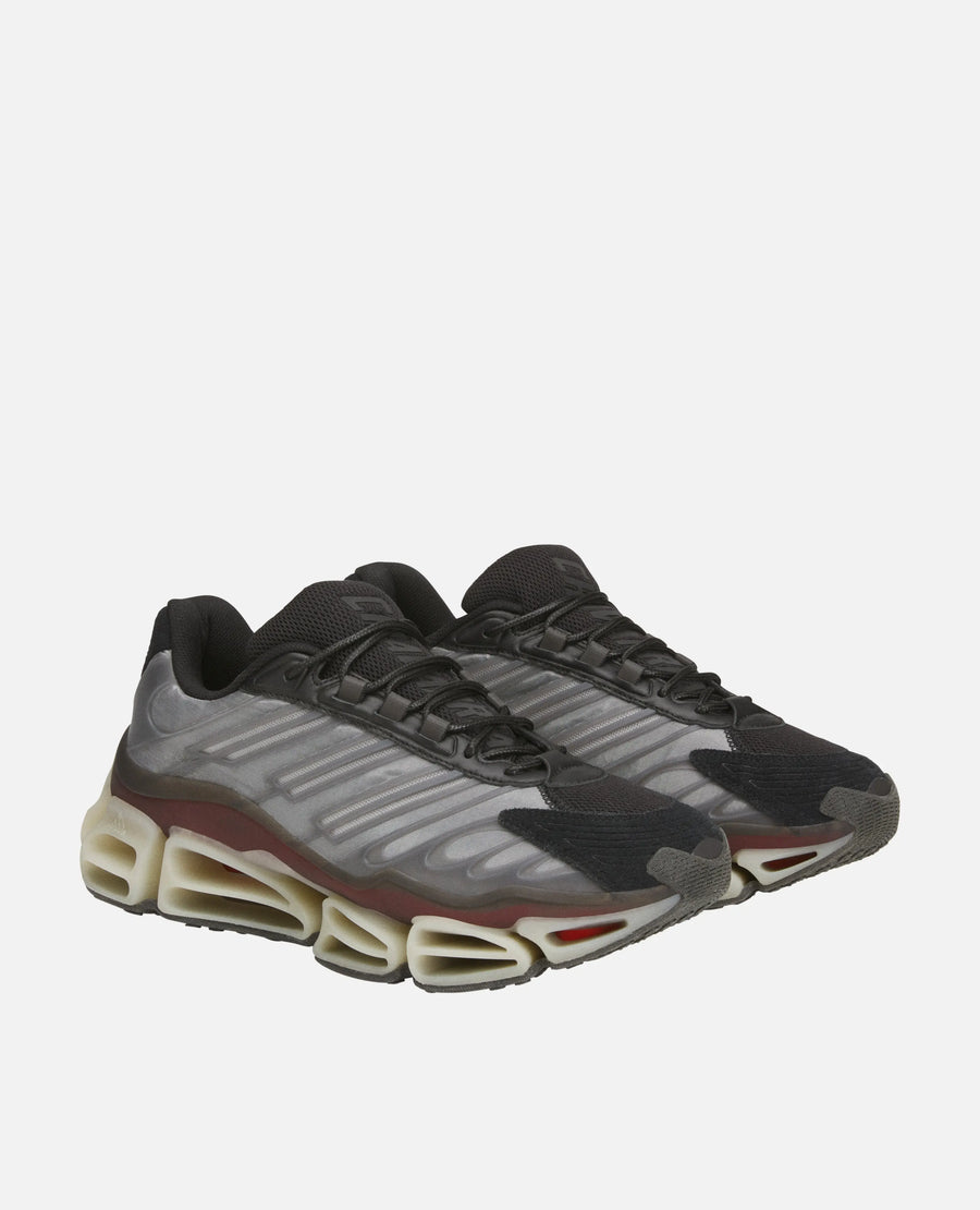 Adidas Chavarria Megaride sneakers in black and grey, displayed in a three-quarter studio view.