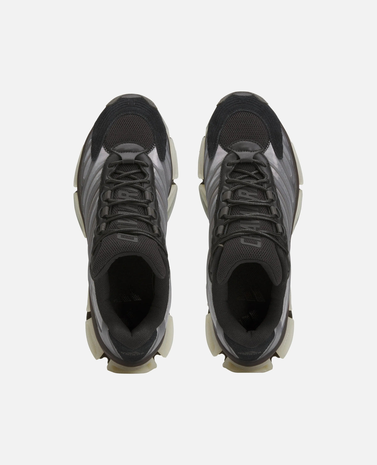 Top-down view of black adidas Chavarria Megaride sneakers with mesh uppers and chunky soles.