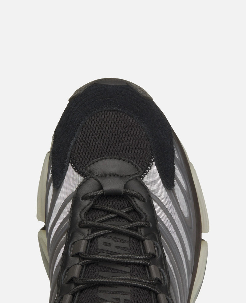 Top-down close-up of the black mesh toe box and laces on the Adidas Chavarria Megaride sneaker.