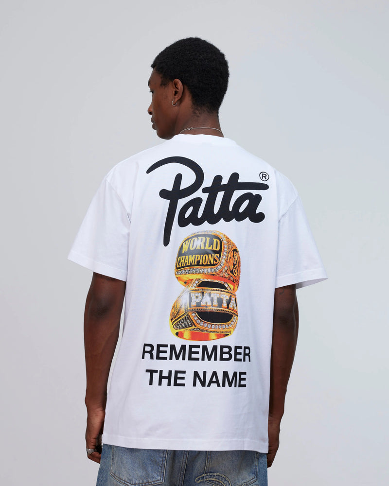 Back view of a model wearing the white Patta Championship T-Shirt with championship rings graphic.