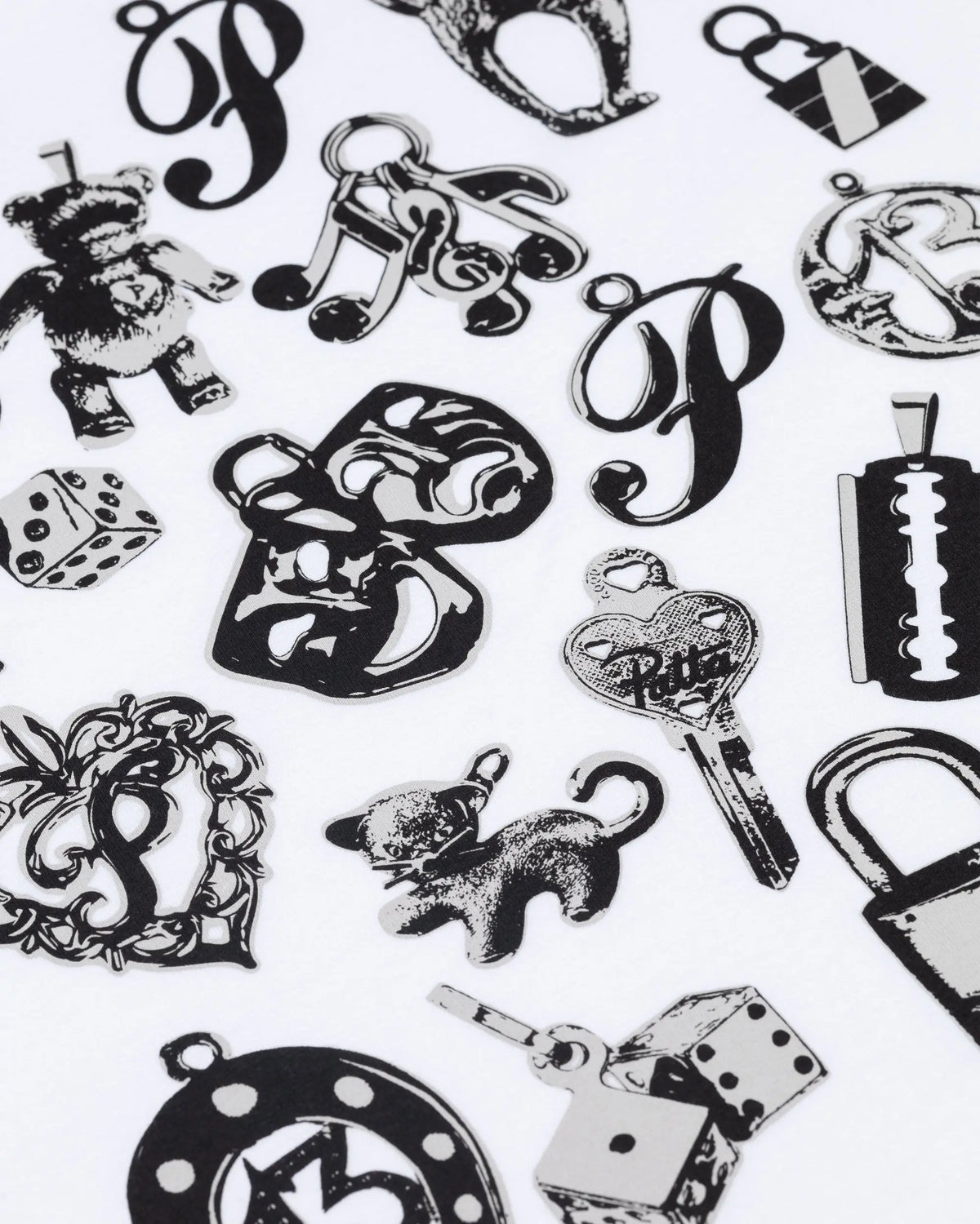 Close-up of black charms graphic print on the white Patta Kids Charm T-Shirt.
