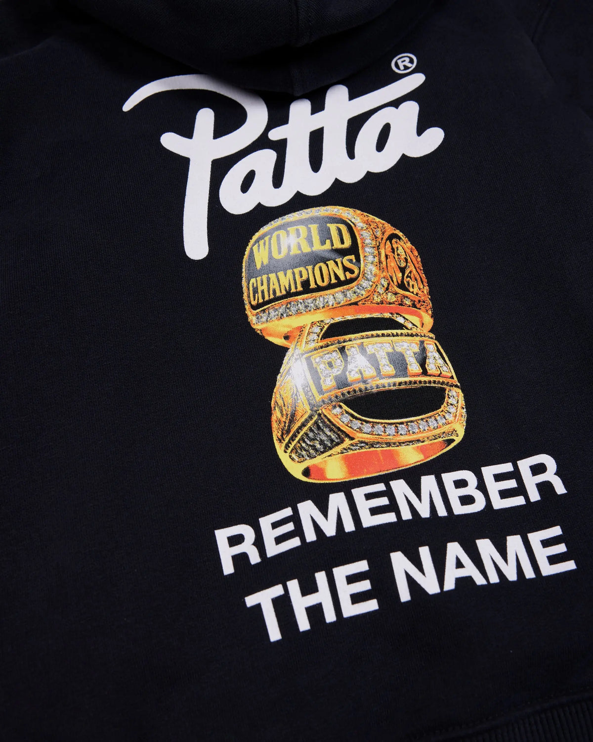 Back artwork detail of the black Patta Kids Championship hoodie with championship rings and logo print.
