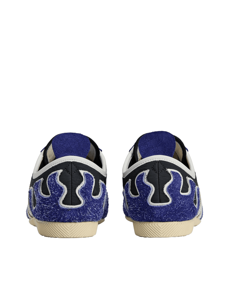 Rear view of adidas Japan LO Brain Dead sneakers featuring blue hairy suede flame heel panels.