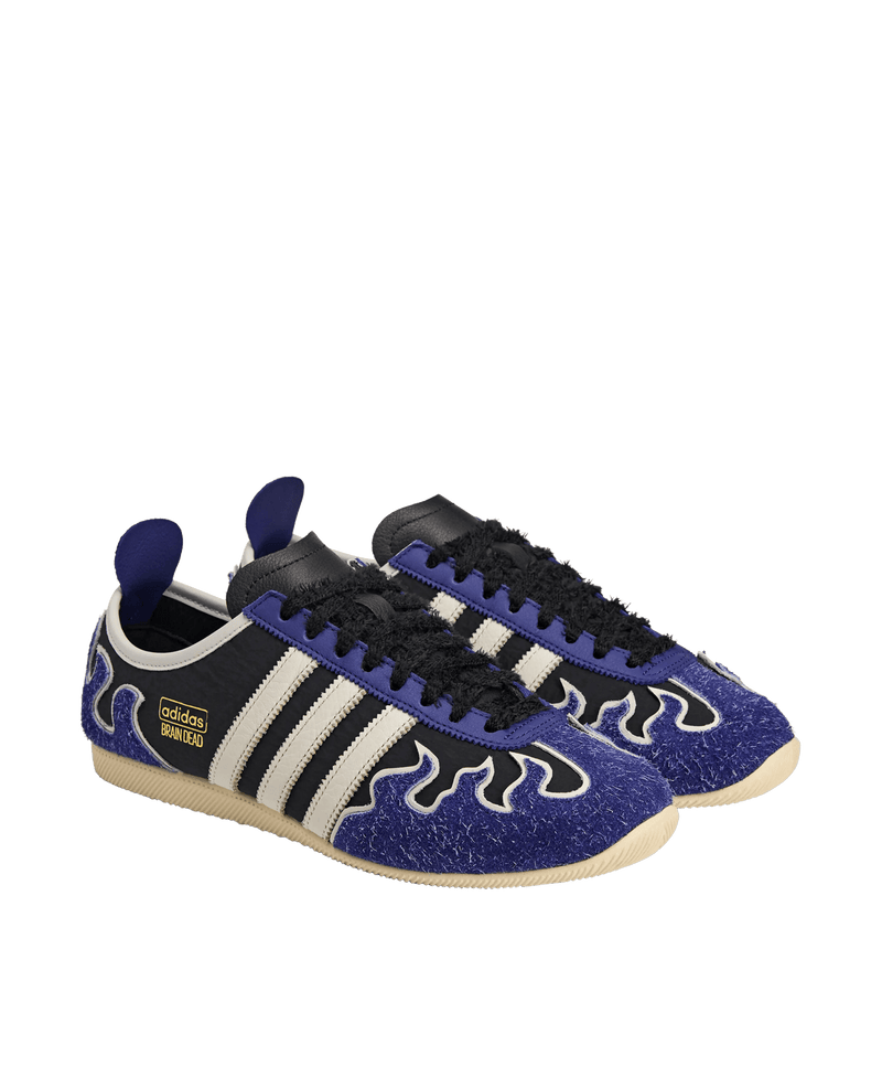 adidas x Brain Dead Japan LO sneakers in black with hairy blue flame overlays and off-white 3-Stripes.