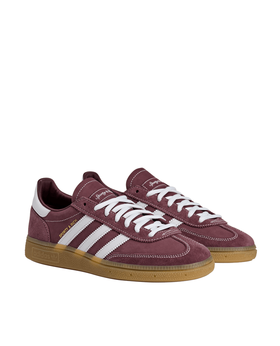 adidas x Sporty & Rich Handball Spezial sneakers in Shadow Red suede with white stripes and gum soles.