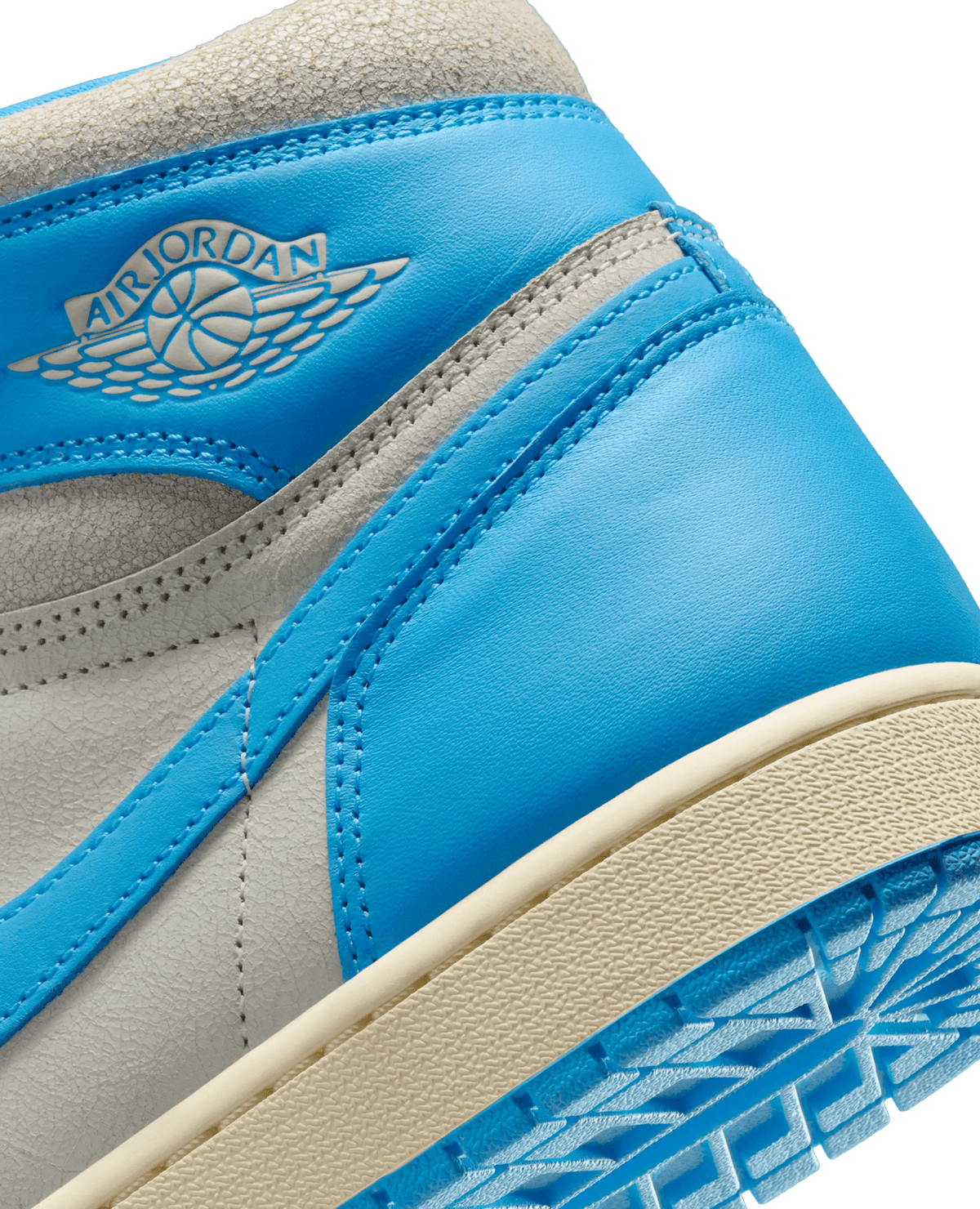 Close-up of the Air Jordan 1 Retro High UNC Reimagined collar in powder blue leather with the Wings logo.