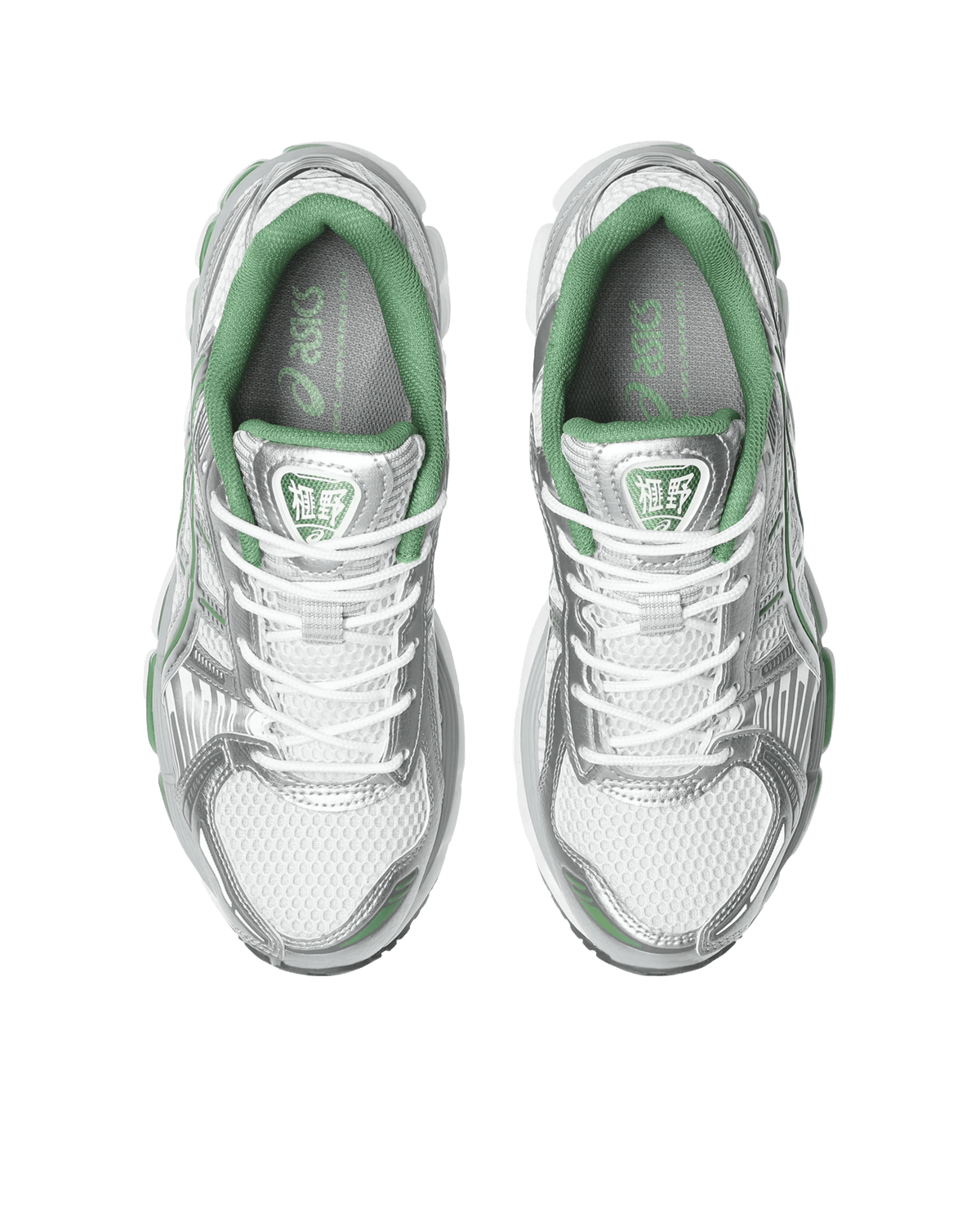 Top-down view of ASICS Gel-Kayano 12.1 running shoes in white and pure silver with green accents.