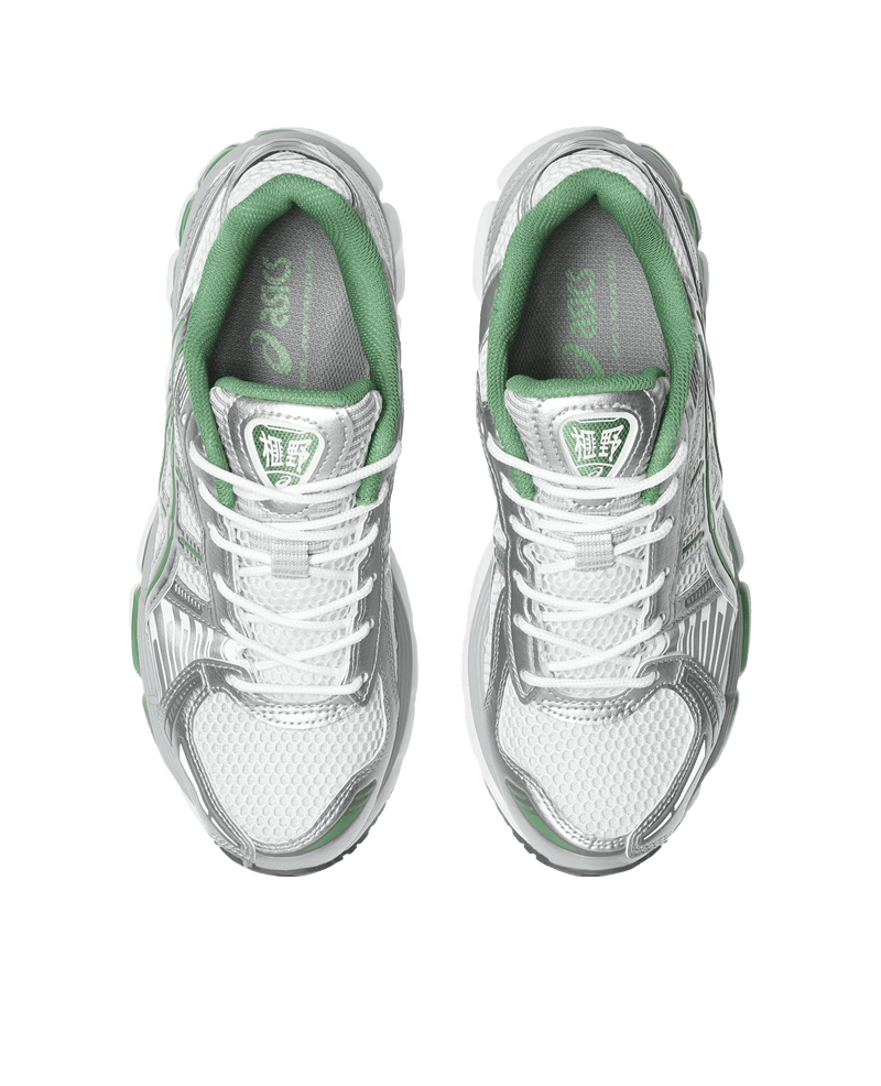 Top-down view of ASICS Gel-Kayano 12.1 running shoes in white and pure silver with green accents.