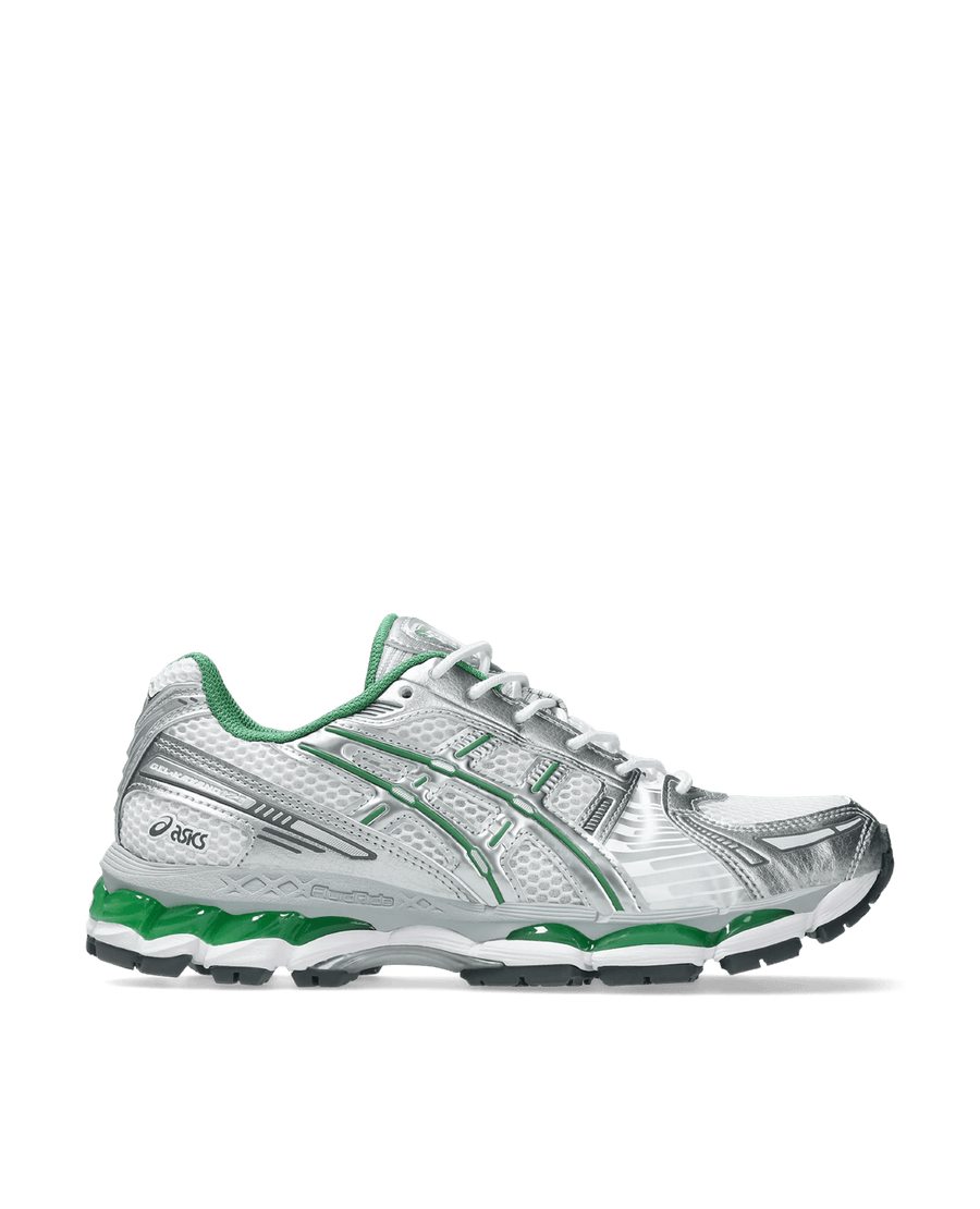 Side profile of the ASICS Gel-Kayano 12.1 sneaker in white and metallic silver with green accents.