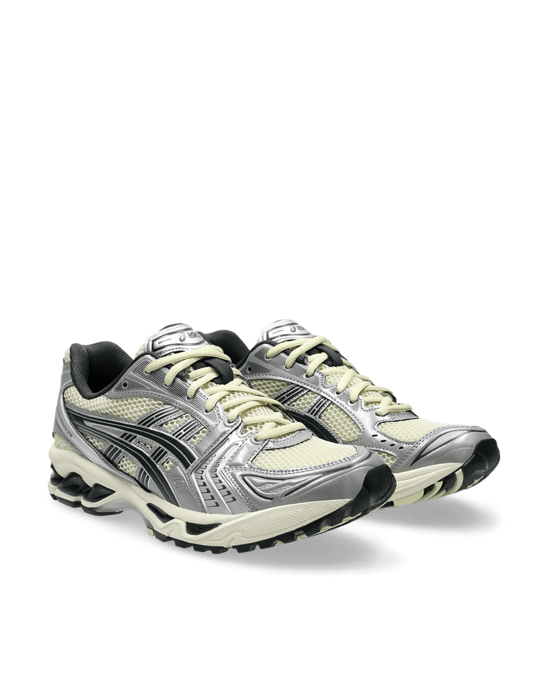 ASICS Gel-Kayano 14 sneakers in Oyster White and Steeple Grey with metallic silver overlays.