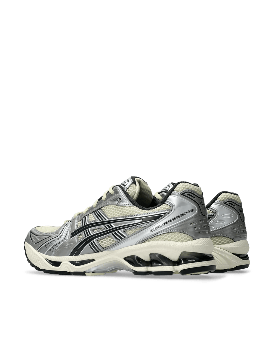 ASICS Gel-Kayano 14 sneakers in Oyster White and Steeple Grey with metallic silver overlays.