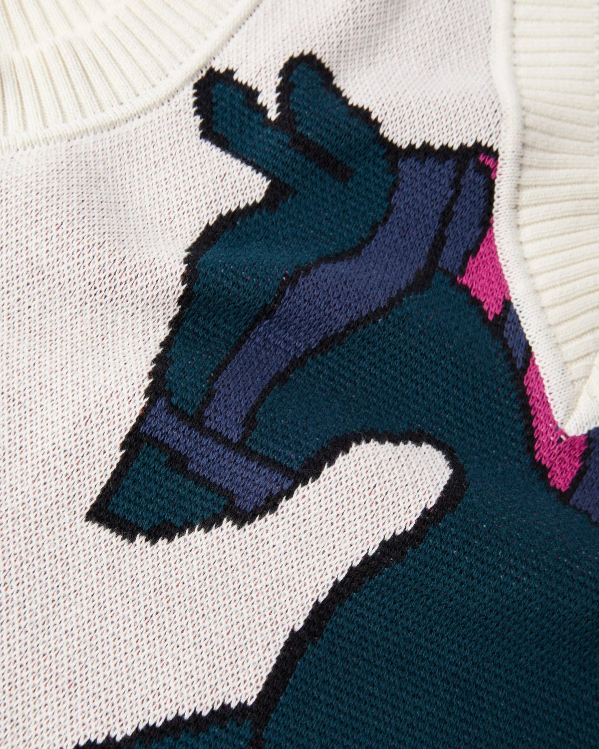 Close-up of the knitted horse design on the off-white byParra spencer vest.