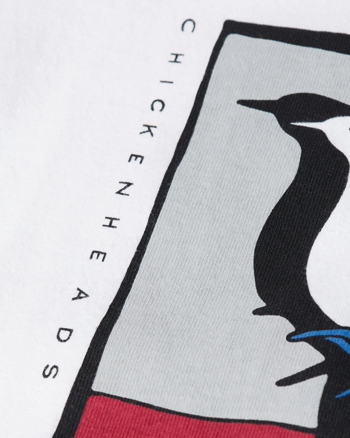 Close-up of the graphic print and Chickenheads lettering on the white ByParra Look At It T-shirt.