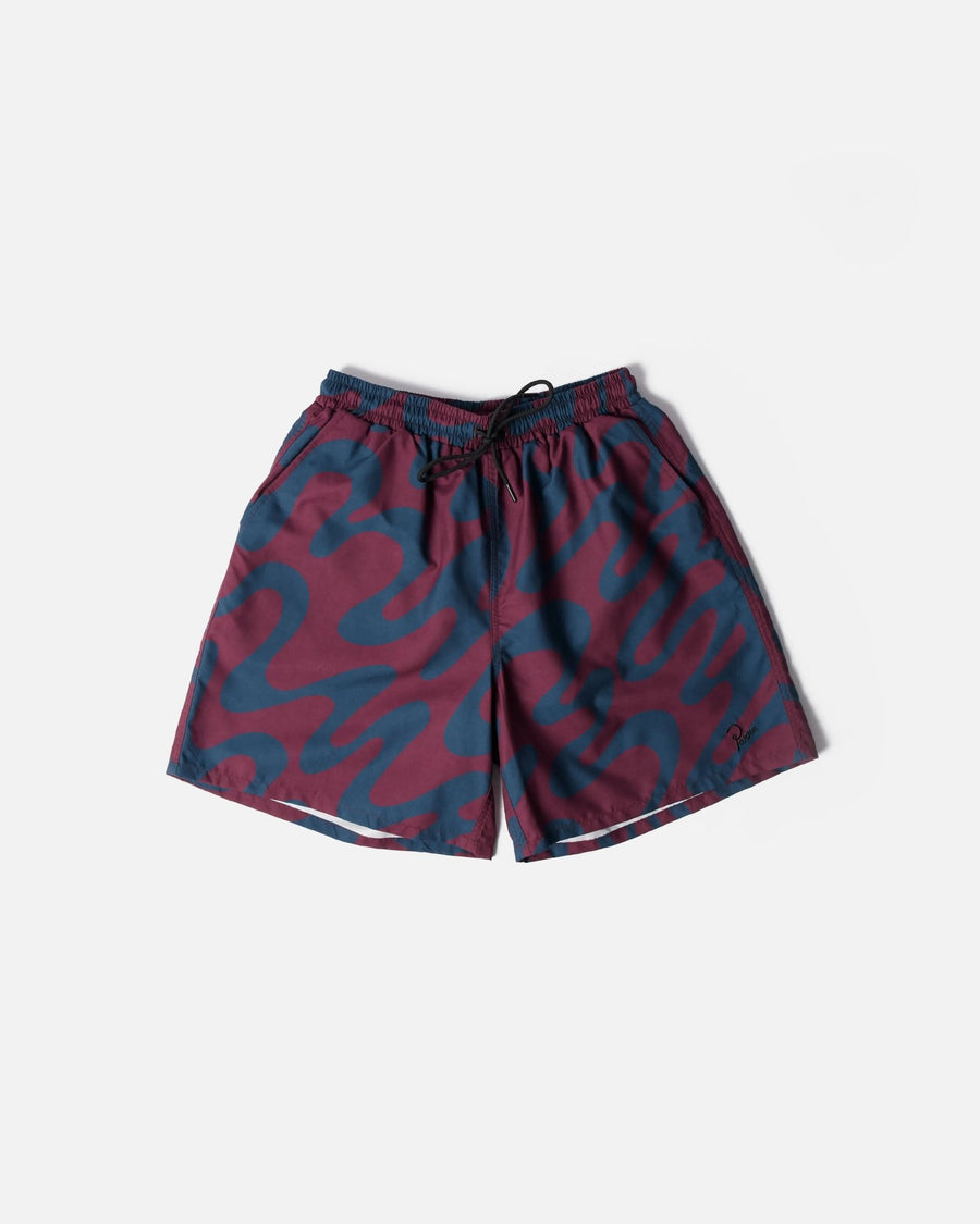 ByParra Splashed Swim Shorts in burgundy with an all-over wavy blue print laid flat.