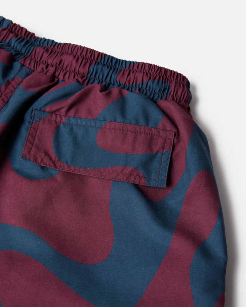 Close-up of the back pocket and waistband on burgundy ByParra Splashed Swim Shorts.