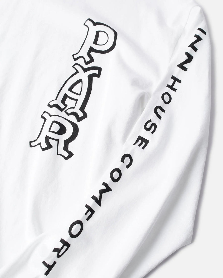 Close-up of graphic lettering on the sleeve of the white ByParra Your Face long-sleeve T-shirt.