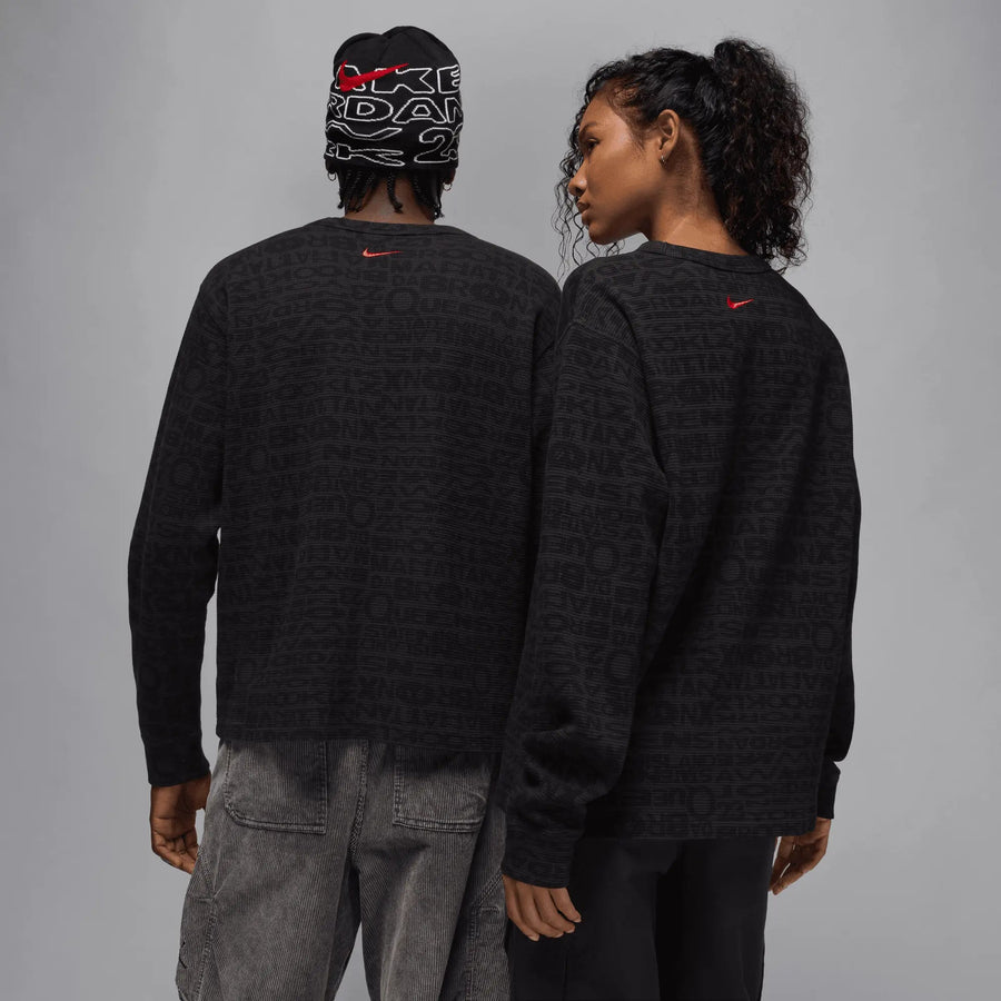 Back view of two models wearing black Jordan x Awake NY long-sleeve thermal shirts.