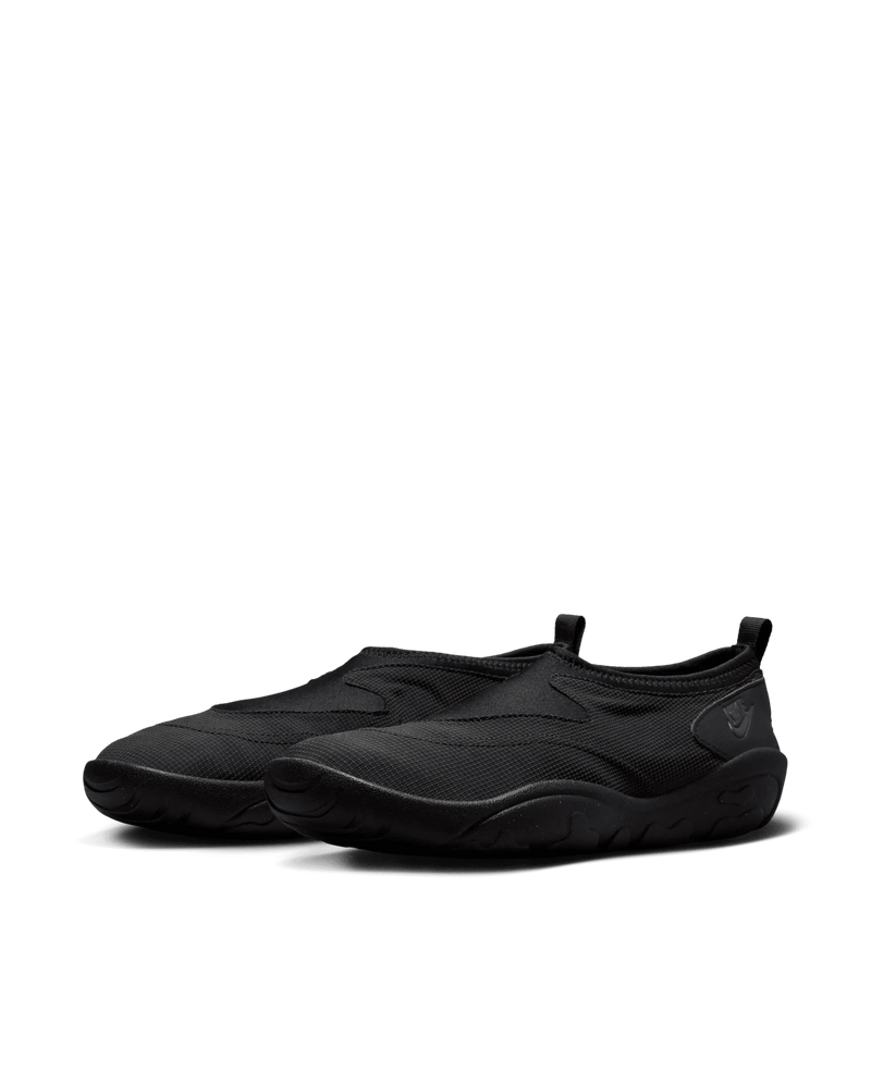 Nike Aqua Turf slip-on sneakers in Black and Off Noir against a black background.