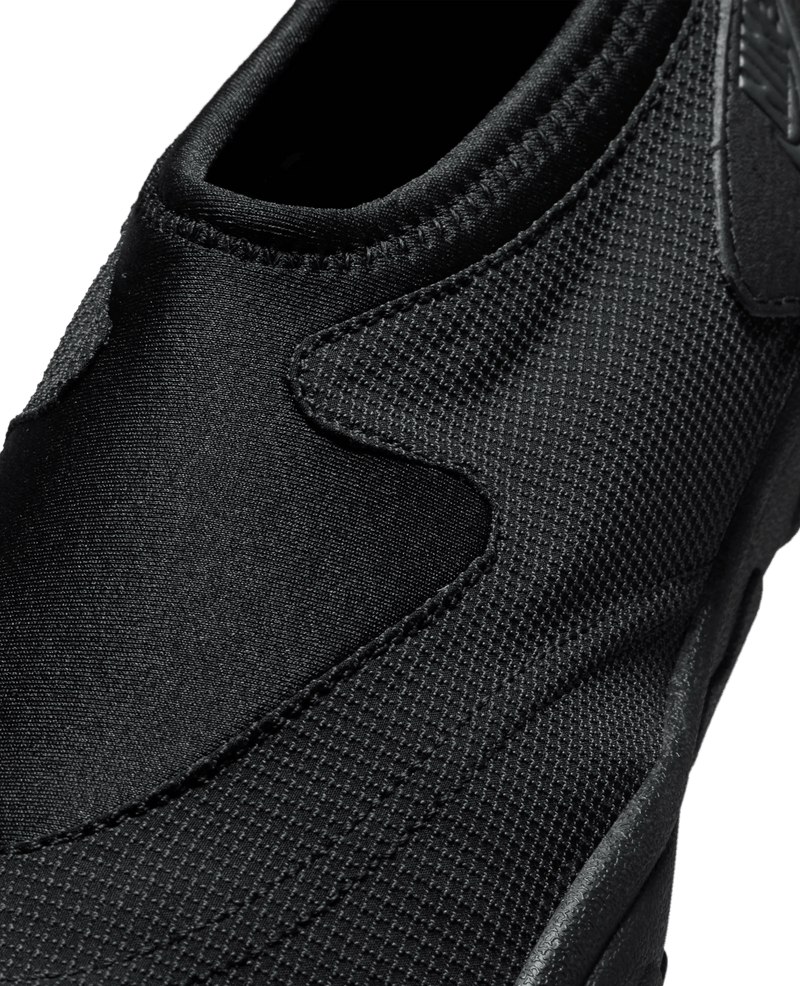 Close-up of the black mesh and neoprene upper on the Nike Aqua Turf shoe.