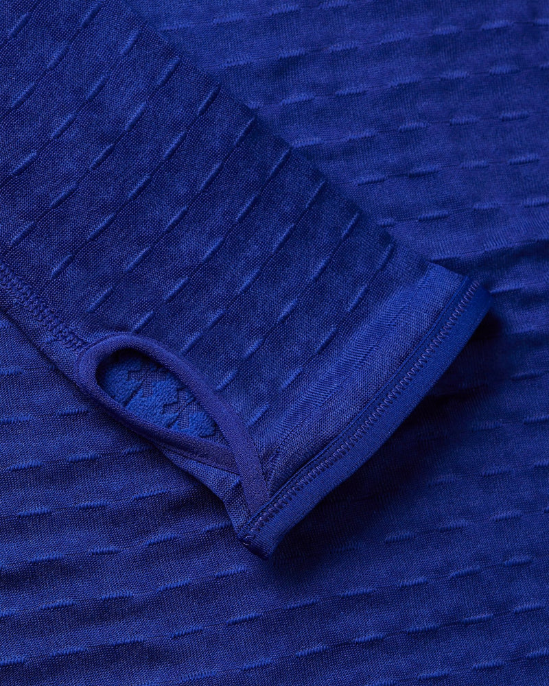 Close-up of the thumbhole cuff on the Nike x Patta Running Team Half-Zip Longsleeve in Deep Royal Blue.