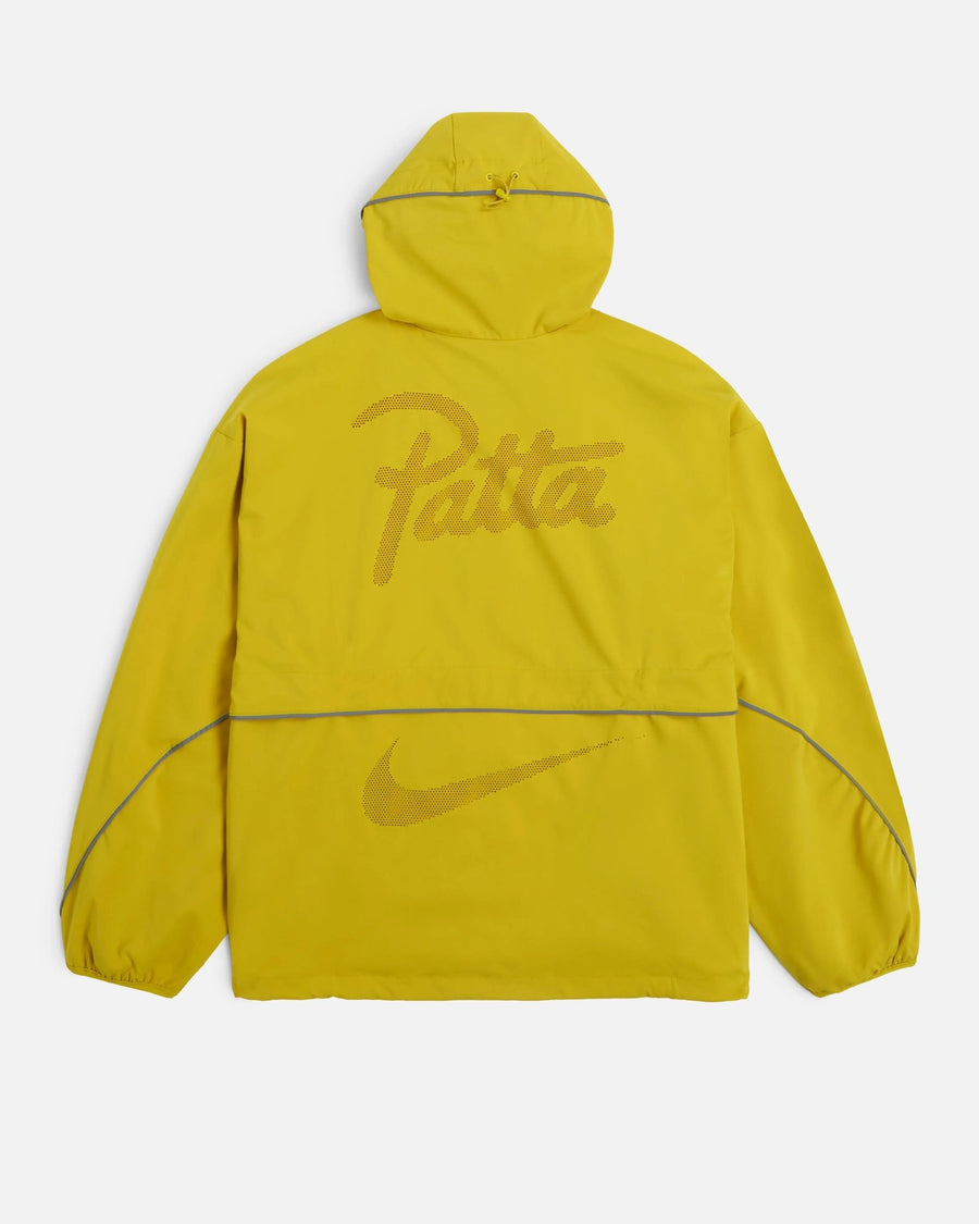 Back view of saffron yellow Nike x Patta hooded track jacket featuring Patta script and Swoosh logos.
