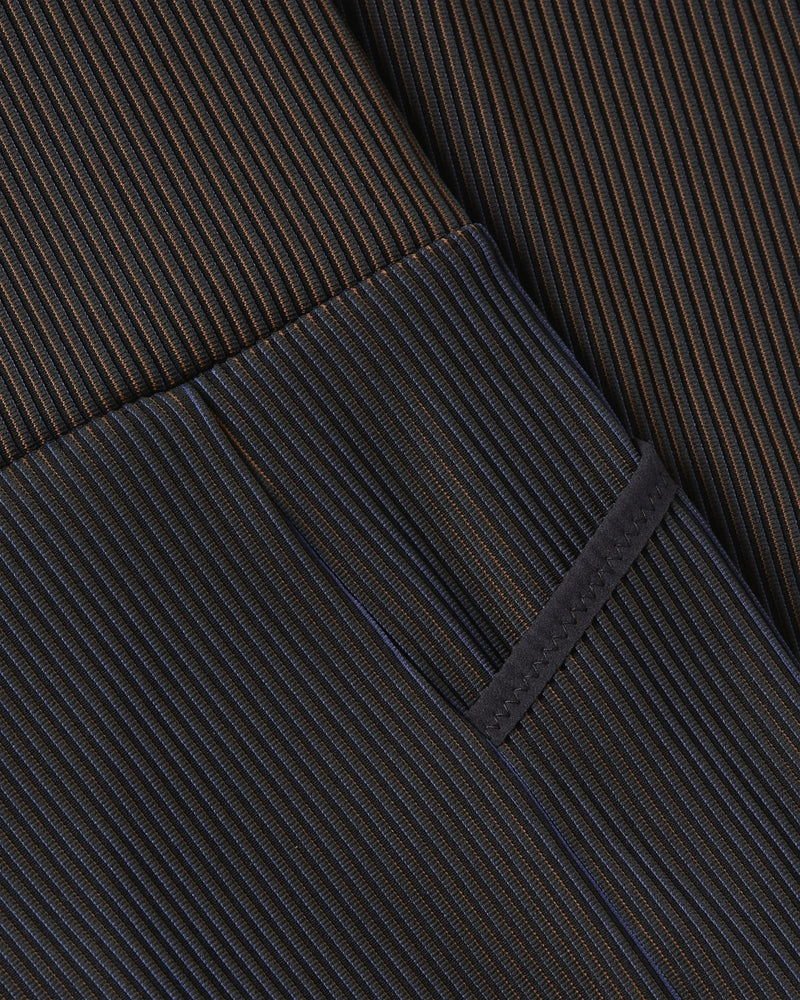 Close-up of ribbed, color-shifting fabric and seams on Nike x Patta Running Team leggings.