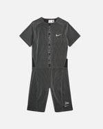 Nike x Patta Running Team race suit in black and grey striped stretch fabric, shown from the front.