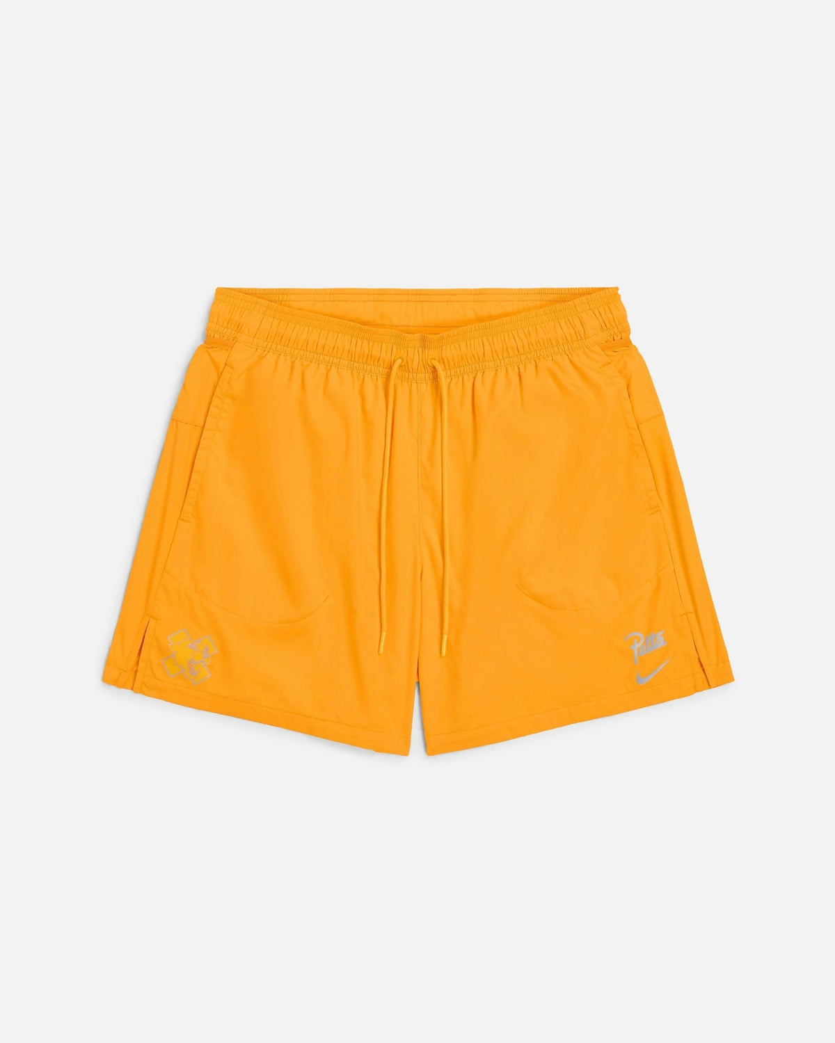 Front view of Nike x Patta Running Team nylon shorts in sundial orange with drawstring waist.