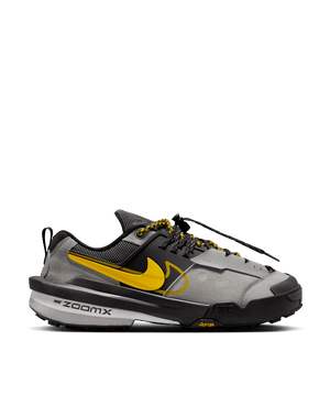 Side profile of Nike Zegamadome x Sacai sneaker in matte silver, tour yellow, and black.