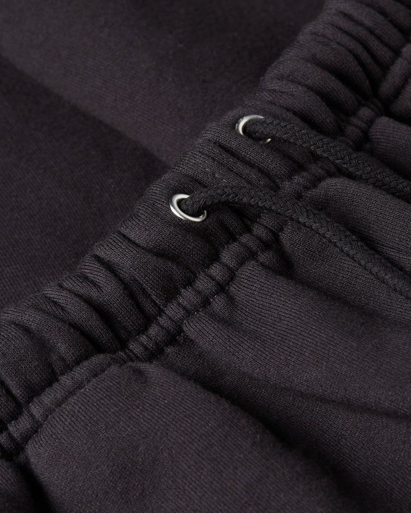 Close-up of the elastic drawstring waistband on the Patta Classic Jogging Shorts in black.