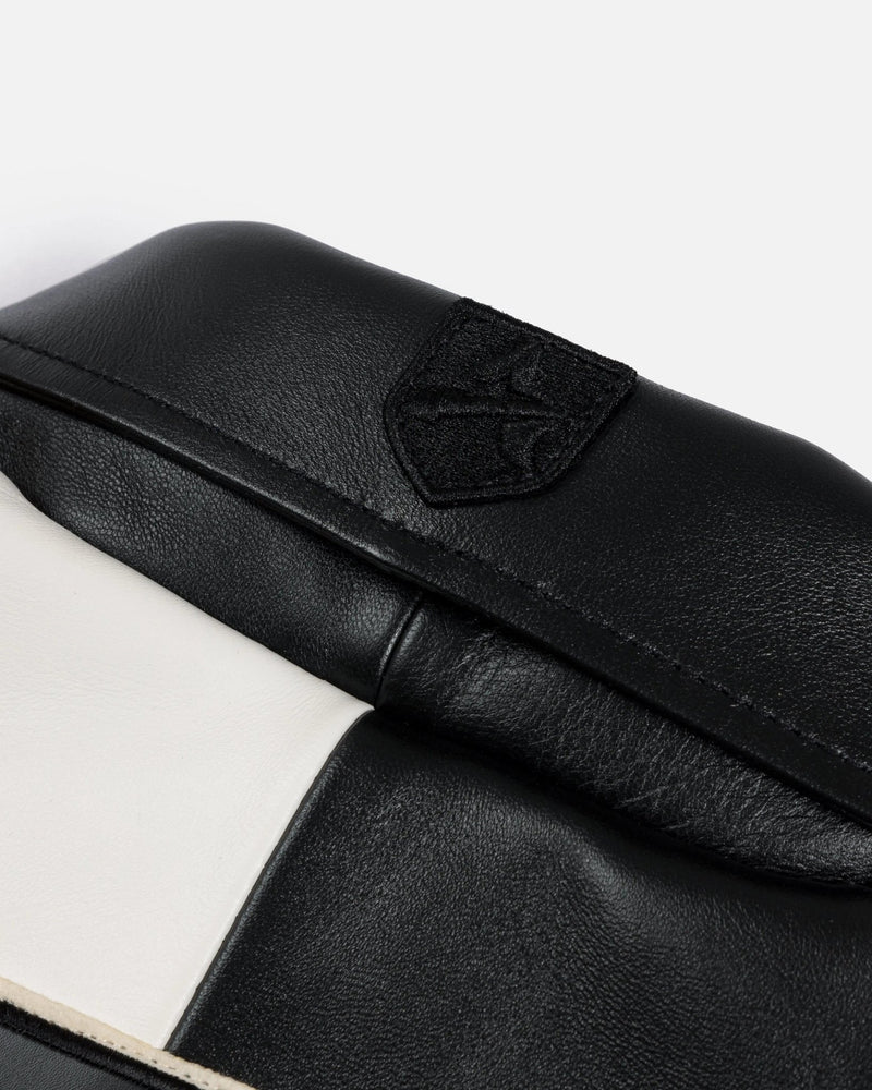 Close-up of tonal black embroidered patch on the leather collar of the Patta x Avirex Icon Jacket.