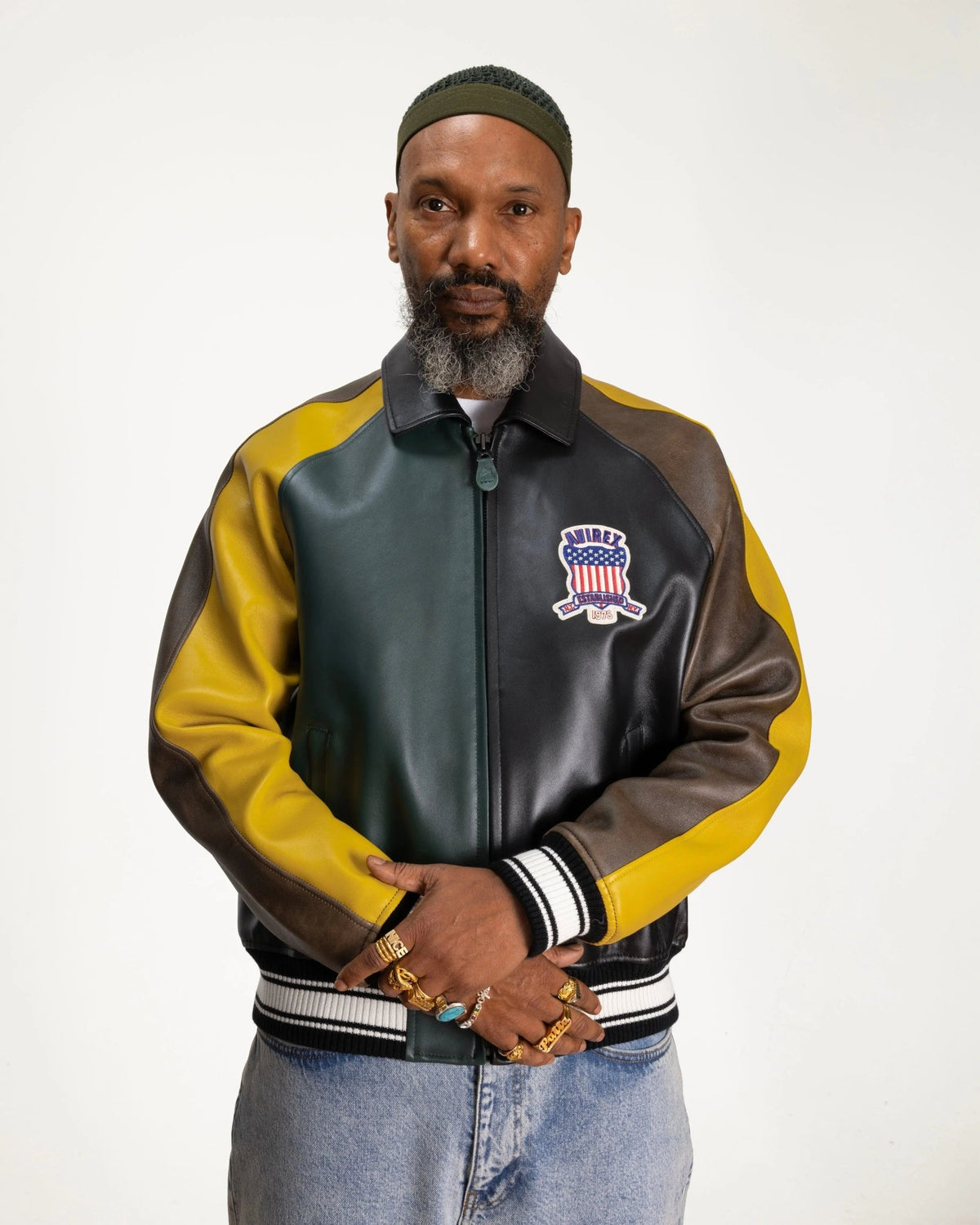 Patta x Avirex Icon Jacket in multicolor leather featuring chest patch on a model.