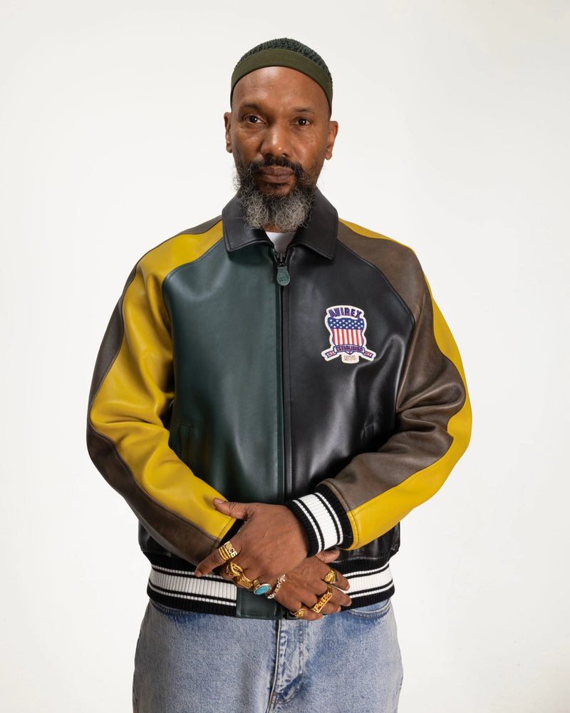 Patta x Avirex Icon Jacket in multicolor leather featuring chest patch on a model.