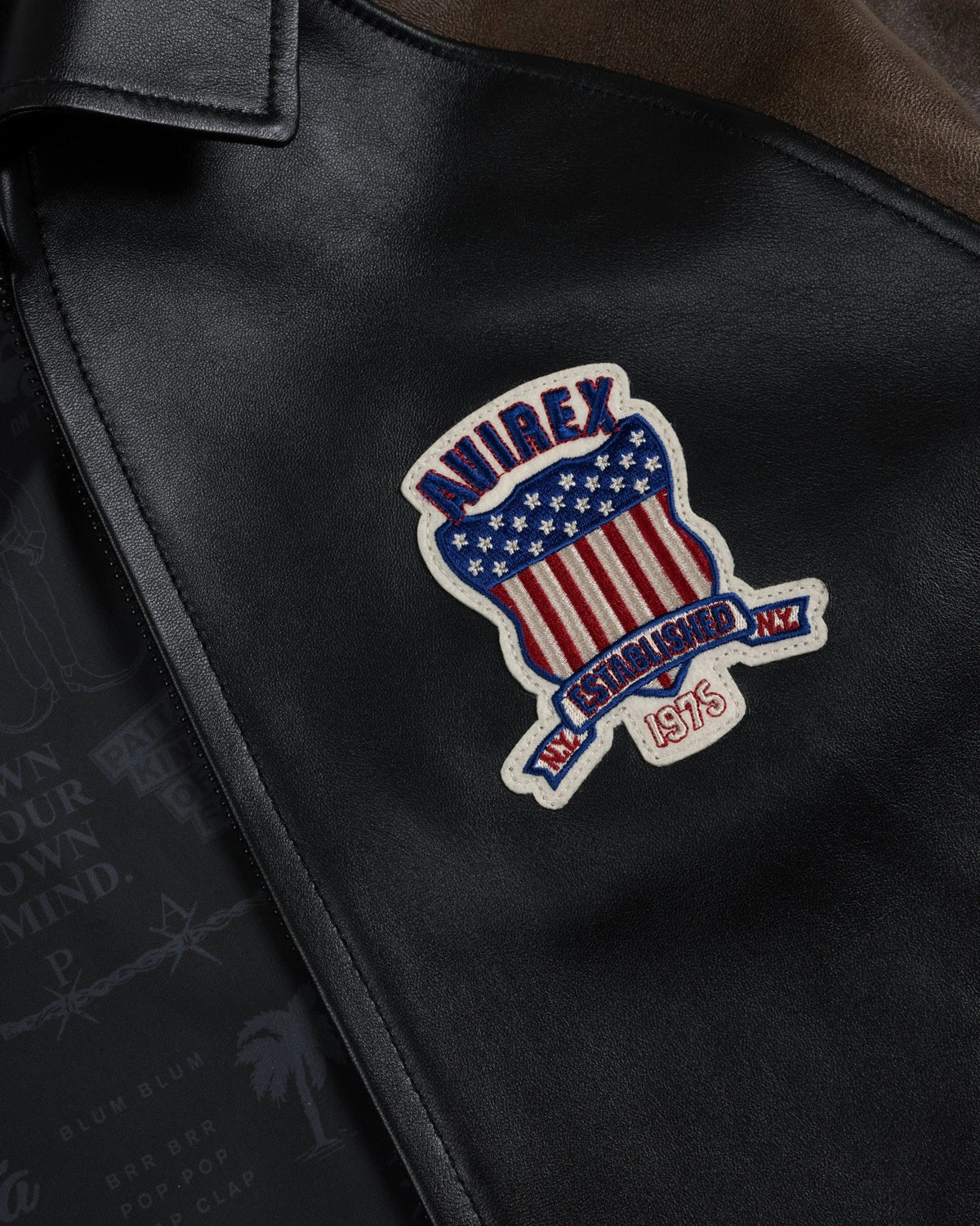 Embroidered Avirex shield patch on the black leather Patta x Avirex Icon Jacket.