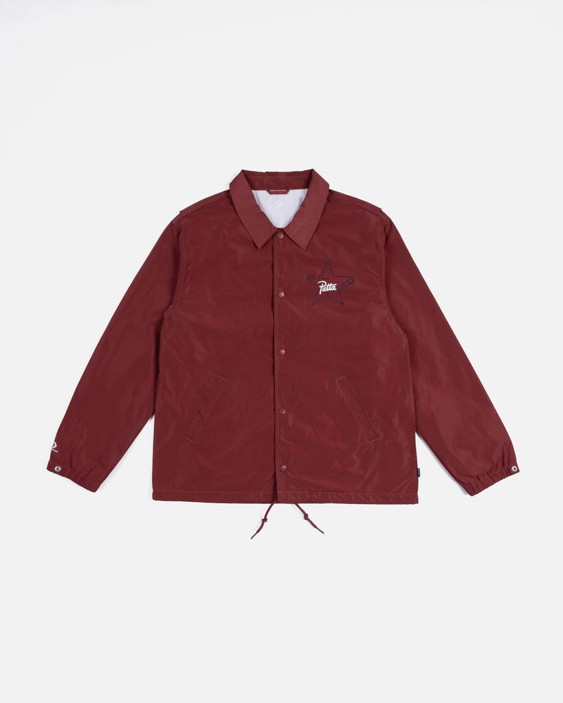 Front view of the Patta x Converse Coaches Jacket in garnet red laid flat against a white background.