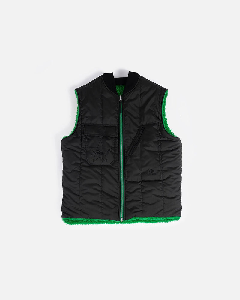Patta x Converse reversible vest in black quilted nylon with green fleece lining on a white background.