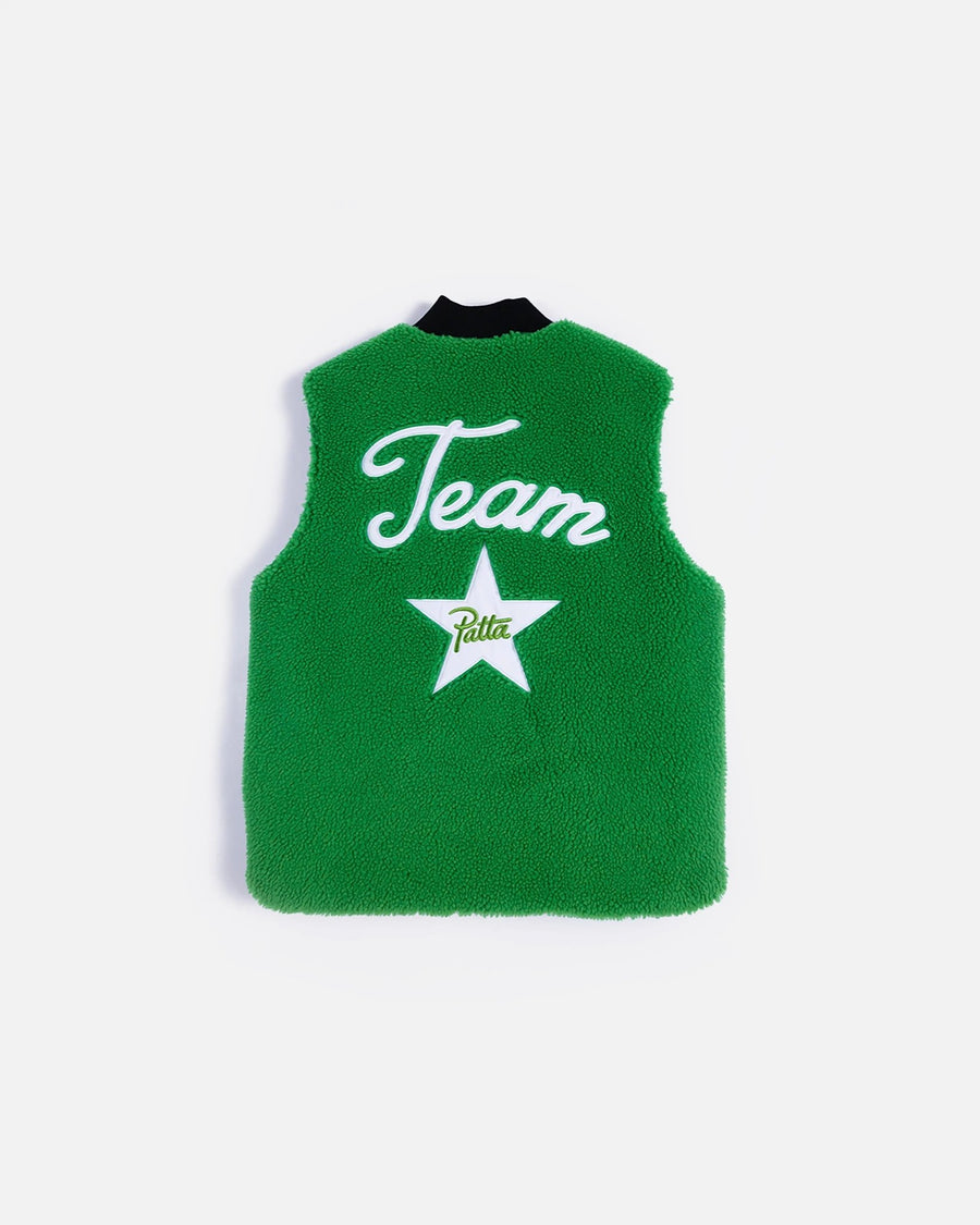 Back view of the jolly green Patta x Converse reversible vest featuring white Team Patta star patches.
