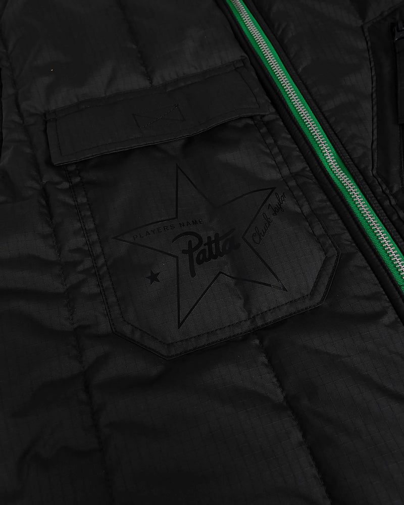 Close-up of the black ripstop pocket with star graphic on the Patta x Converse Reversible Vest.
