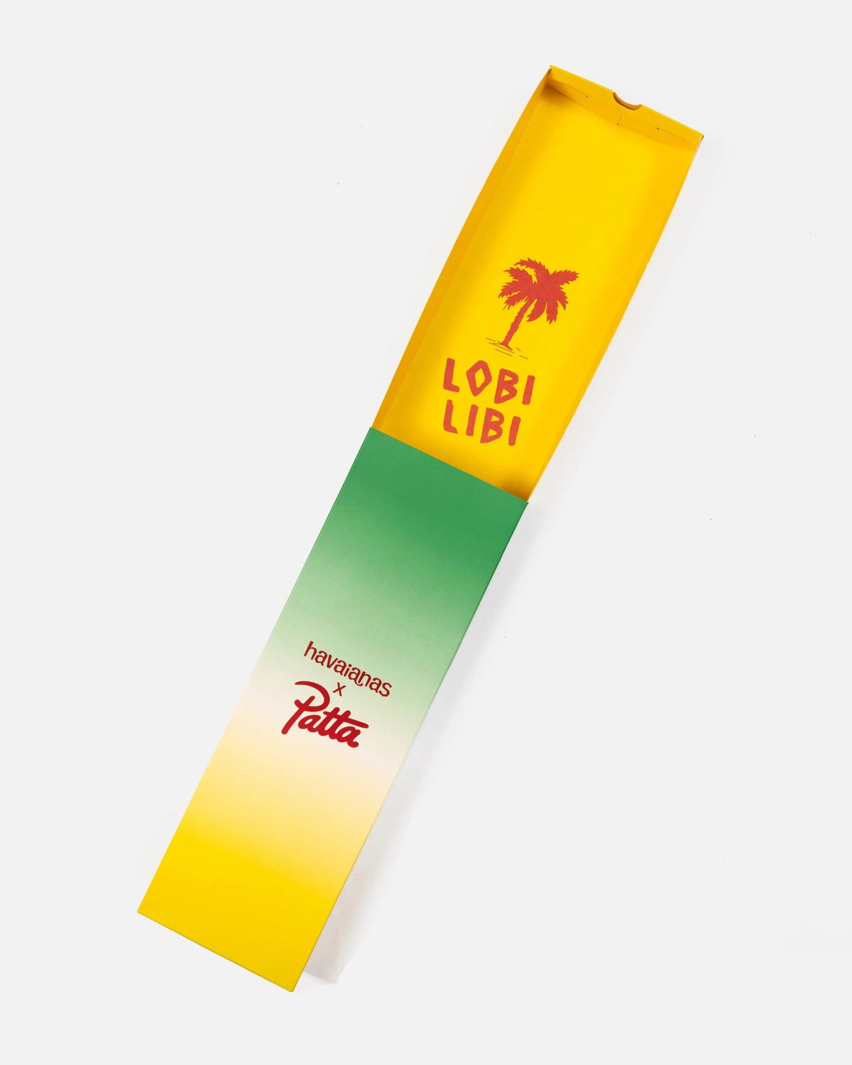 Patta x Havaianas custom green and yellow packaging box with interior Lobi Libi palm tree graphics.