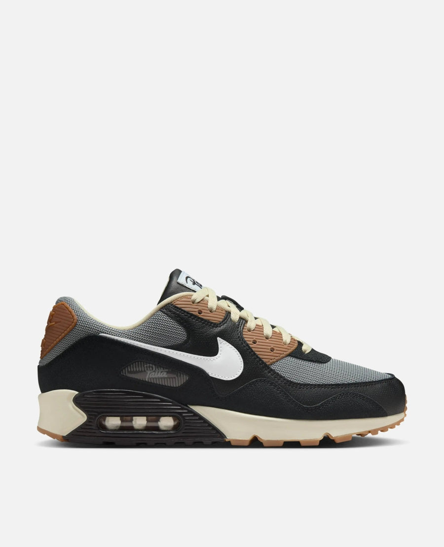Side profile of the Patta x Nike Air Max 90 SP sneaker featuring black leather, grey mesh, and a white Swoosh.