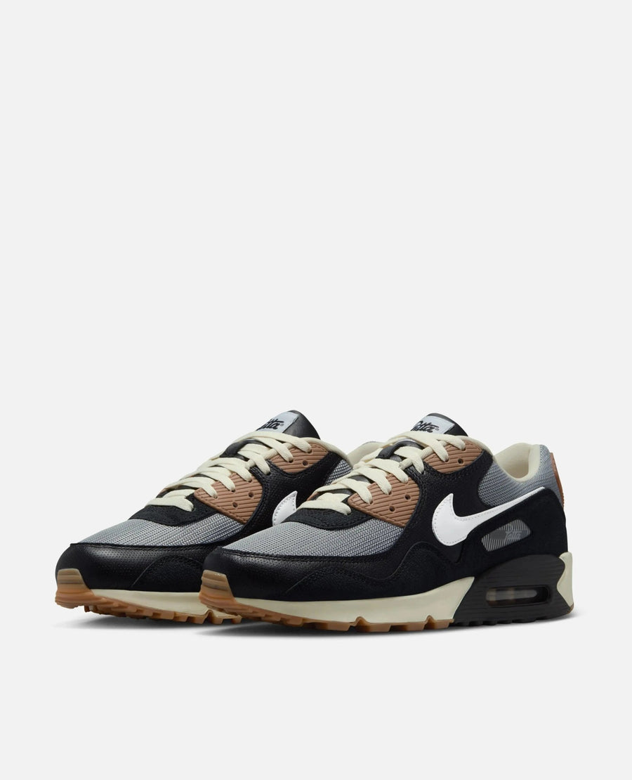 Patta x Nike Air Max 90 SP sneakers in black, particle grey, and white leather and mesh.