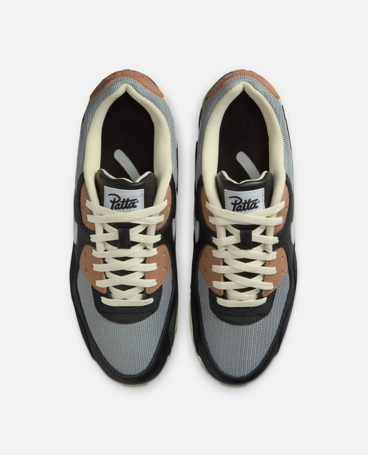 Top-down view of Patta x Nike Air Max 90 SP sneakers in grey mesh and black leather with cream laces.