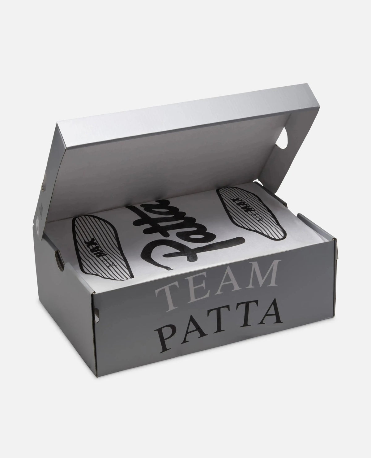 Open silver Patta x Nike Air Max 90 SP sneaker box with Team Patta branding and custom tissue paper.